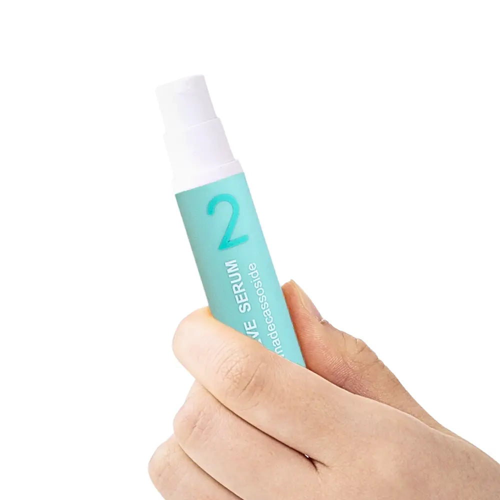 Hand holding KDL Centellieve Serum designed for soothing, moisturizing, and strengthening the skin barrier.