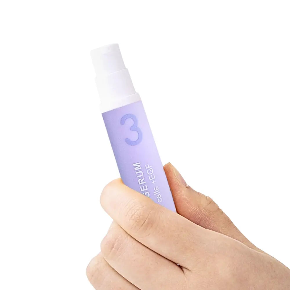 Hand holding KDL Stempid Peptide Serum designed to enhance elasticity and reduce fine lines.