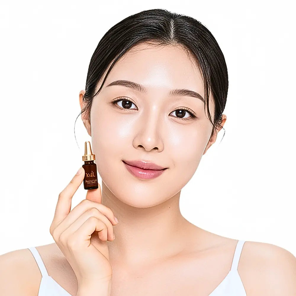 Model applying KDL Revital Lift Booster Ampoule to tighten skin and reduce fine lines.