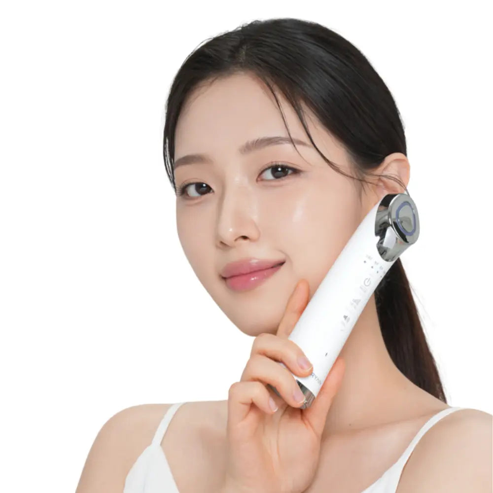 Model using VERYAN electroporation skincare device to boost serum absorption, improve elasticity, and lift sagging skin at home.