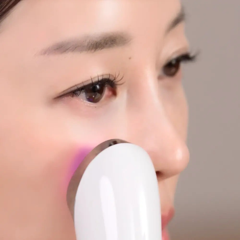 Close-up of VERYAN PRO facial device being used around the nose and cheek area for targeted skincare