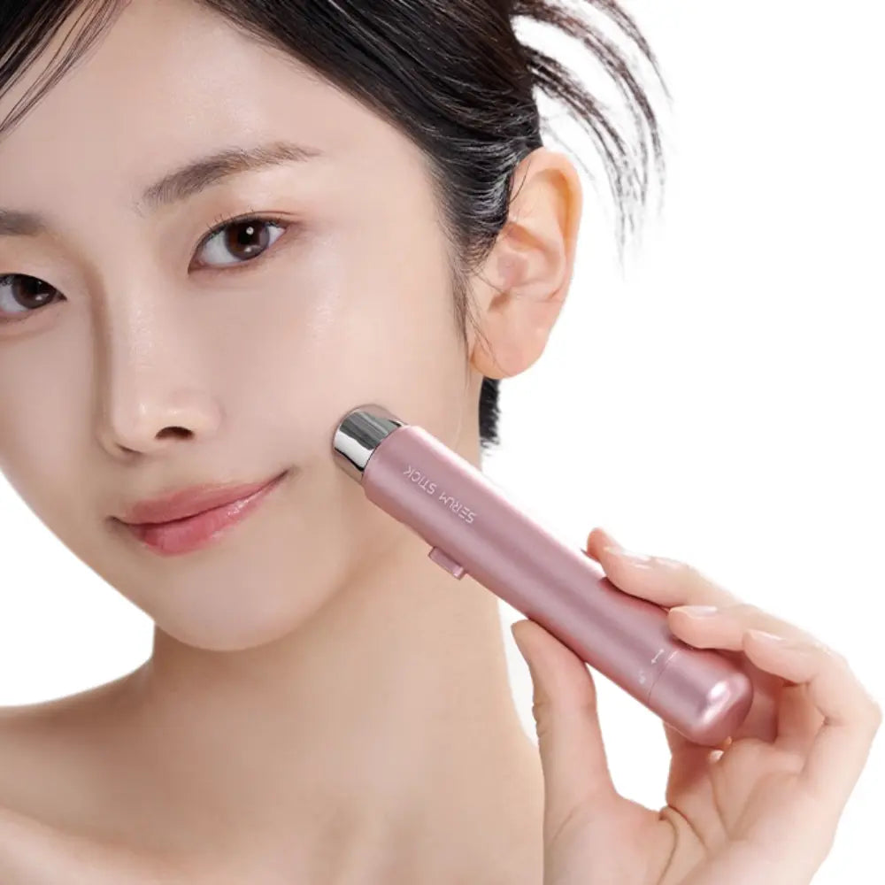 Model using VERYAN Serum Stick for deep hydration and facial lifting, enhancing serum penetration into the skin.
